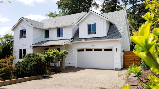13511 SE Barbara Jean Ct, Clackamas, OR 97015 - view of front of property with concrete driveway, board and batten siding, and a shingled roof