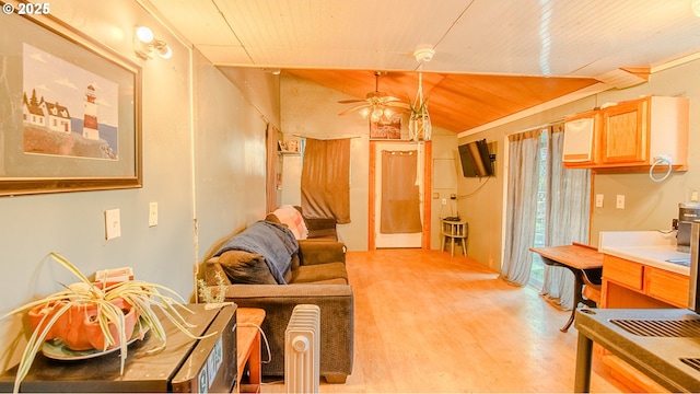 living room featuring ceiling fan, lofted ceiling, wooden ceiling, and light wood-type flooring