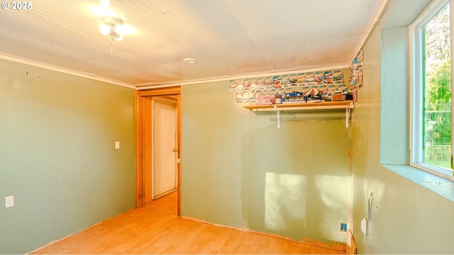 unfurnished room featuring a healthy amount of sunlight and hardwood / wood-style floors