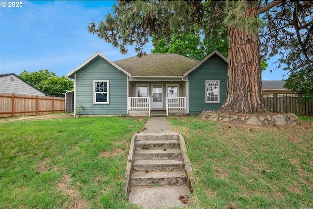 view of front of property with covered porch and roof with shingles