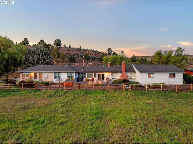40290 Beaver Creek Loop, Baker City, OR 97814 - back of house at dusk with a chimney