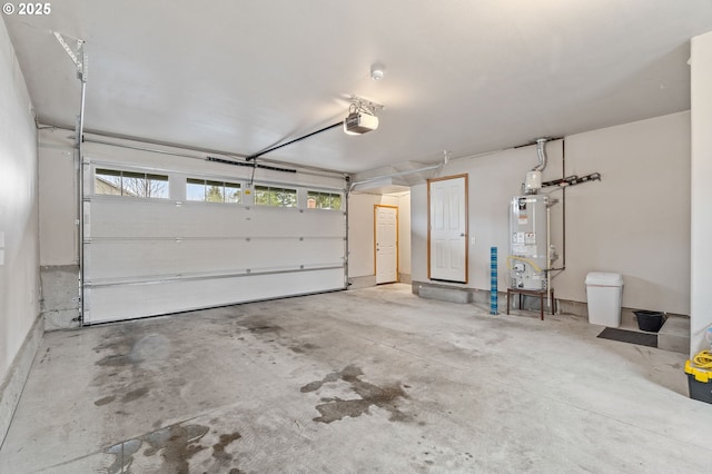 garage featuring a garage door opener and water heater