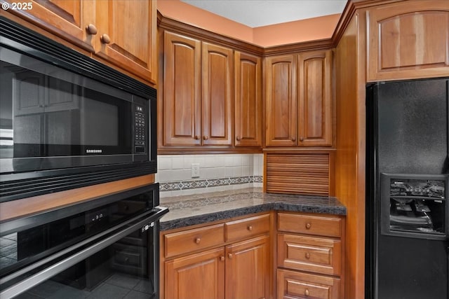 14255 SW Parmele Rd, Gaston, OR 97119 - kitchen featuring black appliances, decorative backsplash, dark countertops, and brown cabinets