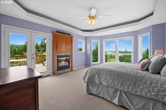 14255 SW Parmele Rd, Gaston, OR 97119 - bedroom with a tray ceiling, access to exterior, light carpet, french doors, and multiple windows