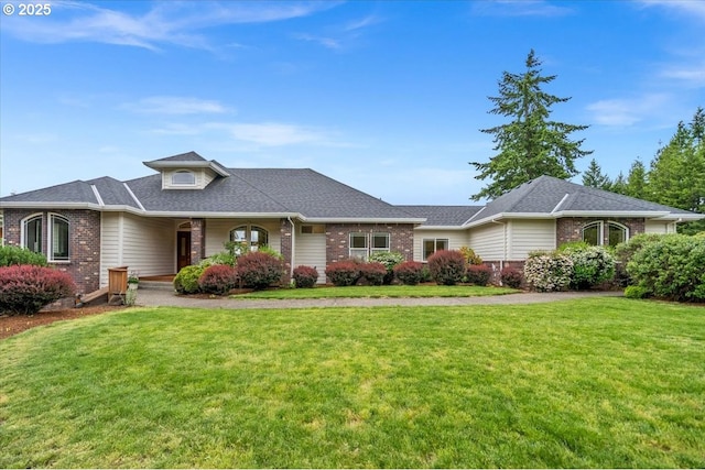 14255 SW Parmele Rd, Gaston, OR 97119 - view of front of house with brick siding, a front lawn, and a shingled roof