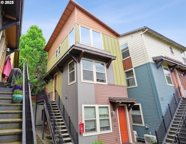 view of front of home with stairway and central air condition unit