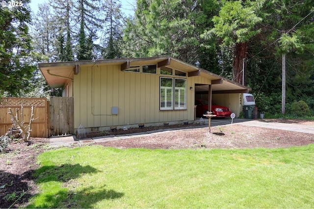 1695 N 17th St, Coos Bay, OR 97420 - view of front of property with crawl space, concrete driveway, and a carport