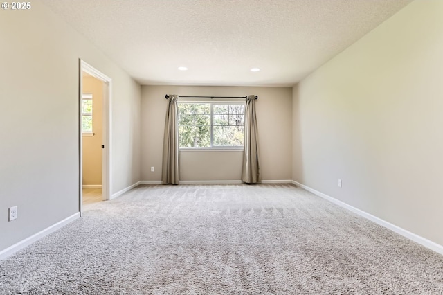 7156 NW Abigail Ter, Portland, OR 97229 - carpeted empty room with recessed lighting, baseboards, and plenty of natural light