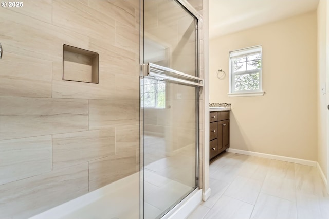 7156 NW Abigail Ter, Portland, OR 97229 - bathroom featuring vanity, baseboards, and a shower stall