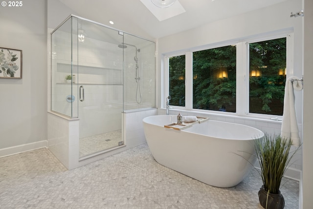3505 SW Beaverton Ave, Portland, OR 97239 - bathroom with a soaking tub, a stall shower, and a skylight