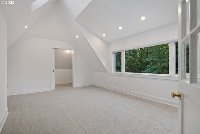 3505 SW Beaverton Ave, Portland, OR 97239 - bonus room featuring vaulted ceiling, carpet floors, recessed lighting, and a skylight