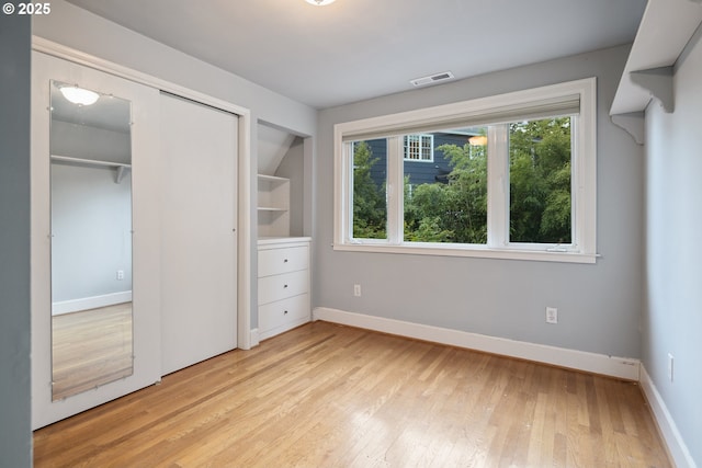 3505 SW Beaverton Ave, Portland, OR 97239 - unfurnished bedroom featuring light wood finished floors and a closet