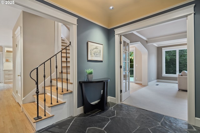 3505 SW Beaverton Ave, Portland, OR 97239 - stairway with crown molding, arched walkways, and stone finish floors