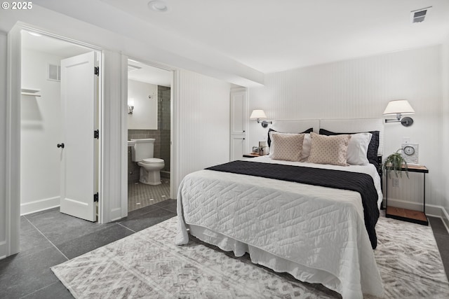 3505 SW Beaverton Ave, Portland, OR 97239 - bedroom featuring tile patterned floors and connected bathroom