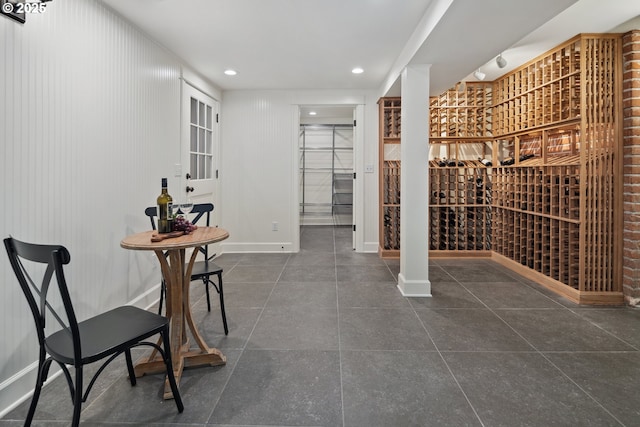 3505 SW Beaverton Ave, Portland, OR 97239 - wine cellar featuring dark tile patterned floors and recessed lighting