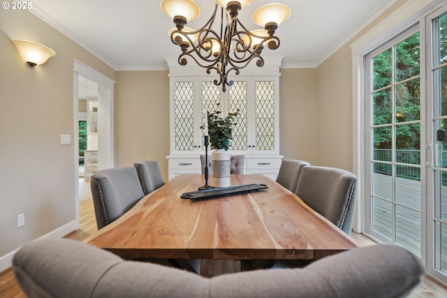 3505 SW Beaverton Ave, Portland, OR 97239 - dining room with a chandelier, ornamental molding, and wood finished floors