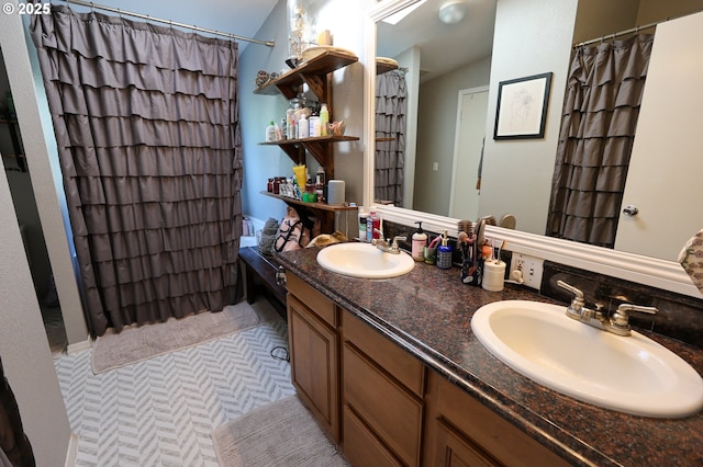 bathroom featuring double vanity, tile patterned flooring, a sink, and a shower with shower curtain