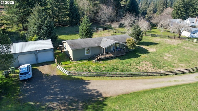 birds eye view of property with a rural view