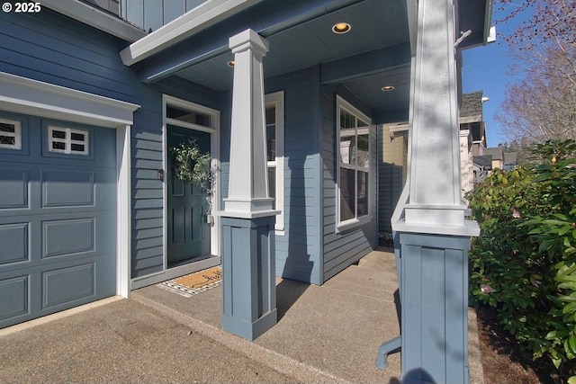 doorway to property with a porch and board and batten siding