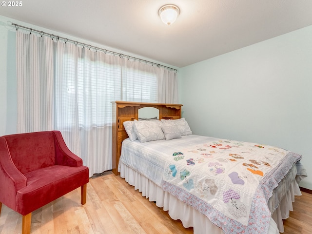 bedroom with light wood-style flooring
