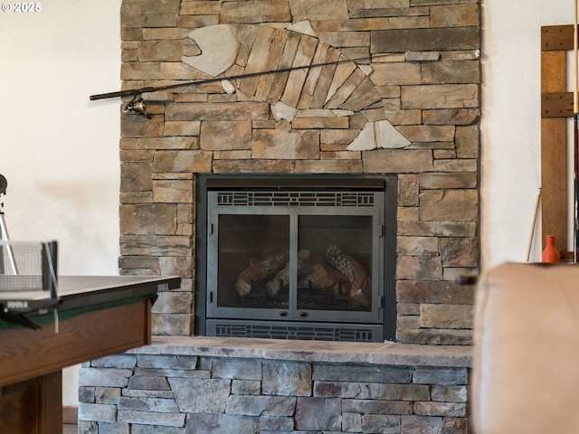 interior details with a stone fireplace