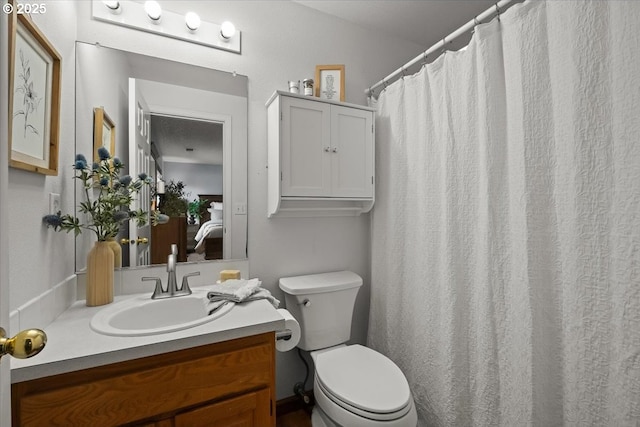 full bath with toilet and vanity