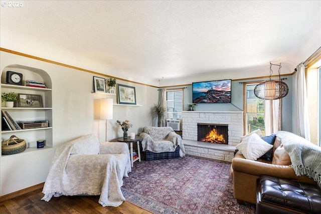 3310 N St N, Vancouver, WA 98663 - living area featuring healthy amount of natural light, dark wood finished floors, a stone fireplace, and cooling unit