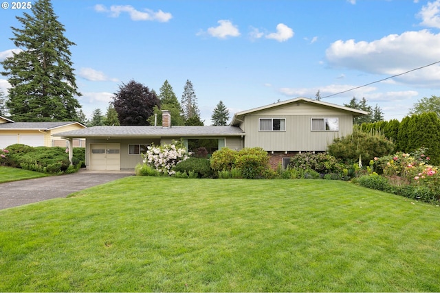 1627 NE 143rd Ave, Portland, OR 97230 - tri-level home with a garage, driveway, a front yard, and a chimney
