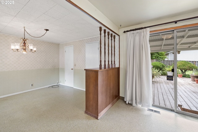 1627 NE 143rd Ave, Portland, OR 97230 - unfurnished room with baseboards, wallpapered walls, and a chandelier