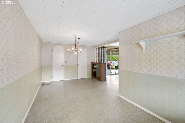 1627 NE 143rd Ave, Portland, OR 97230 - empty room featuring wallpapered walls, a chandelier, and baseboards