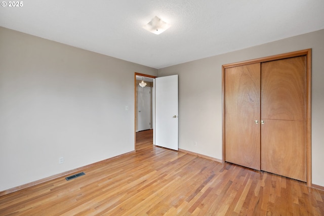 1627 NE 143rd Ave, Portland, OR 97230 - unfurnished bedroom featuring light wood-type flooring, baseboards, and a closet