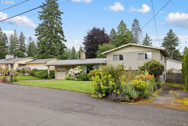 1627 NE 143rd Ave, Portland, OR 97230 - split level home featuring a garage, driveway, and a chimney