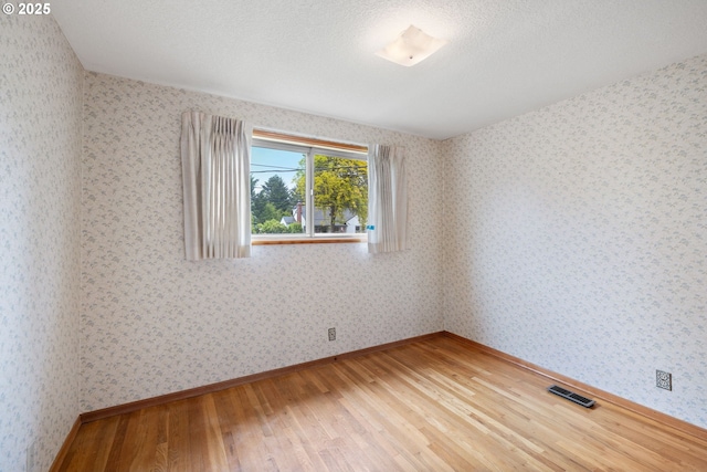 1627 NE 143rd Ave, Portland, OR 97230 - unfurnished room featuring light wood-type flooring and baseboards