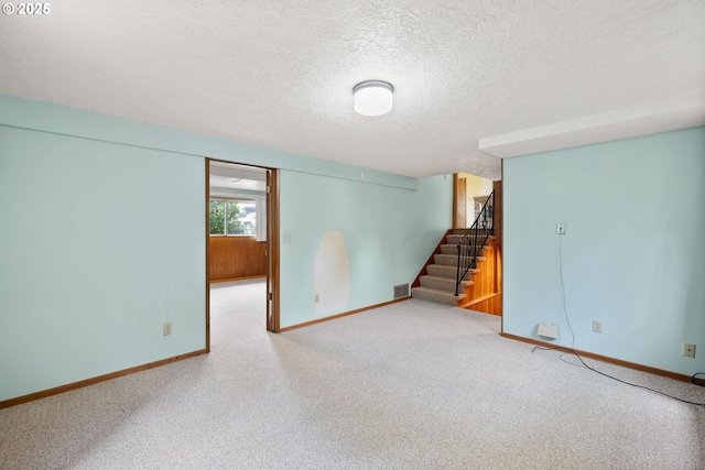 1627 NE 143rd Ave, Portland, OR 97230 - basement featuring baseboards, stairs, and a textured ceiling