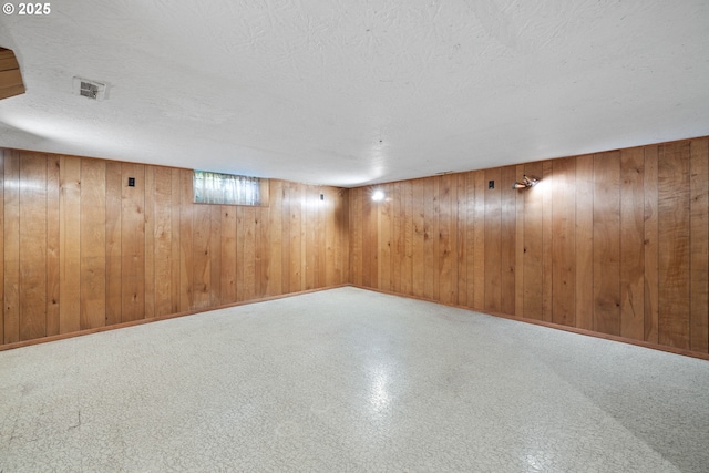1627 NE 143rd Ave, Portland, OR 97230 - finished basement featuring a textured ceiling and wood walls