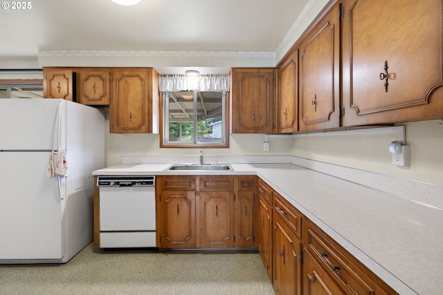 1627 NE 143rd Ave, Portland, OR 97230 - kitchen featuring white appliances, a sink, brown cabinetry, and light countertops