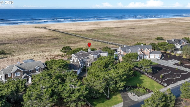 bird's eye view featuring a beach view and a water view