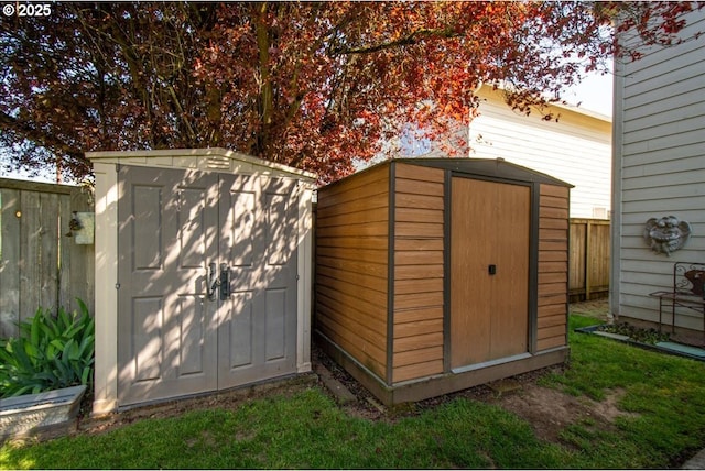view of shed with fence