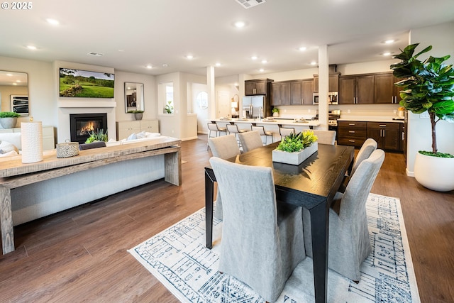 dining room featuring dark hardwood / wood-style flooring