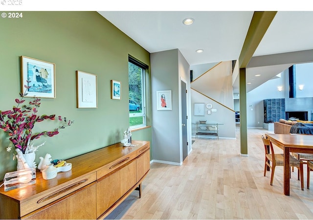 interior space featuring baseboards, recessed lighting, and light wood-style floors