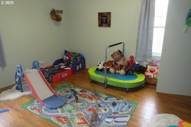 bedroom with wood finished floors