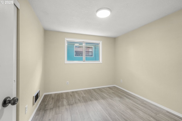 8419 SE Yamhill St, Portland, OR 97216 - empty room with wood finished floors and baseboards