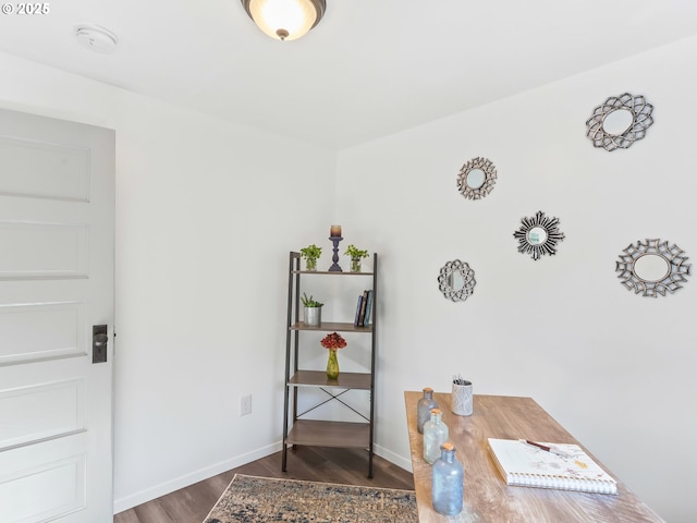 office featuring baseboards and wood finished floors