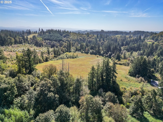 birds eye view of property with a forest view