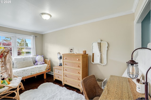 bedroom with crown molding and dark wood-style flooring