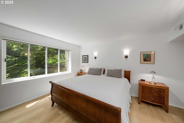 6665 W Burnside Rd, Portland, OR 97210 - bedroom featuring light wood-style floors and baseboards