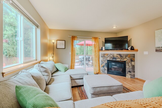 595 Cozy Way, Woodburn, OR 97071 - living room with wood finished floors and a stone fireplace