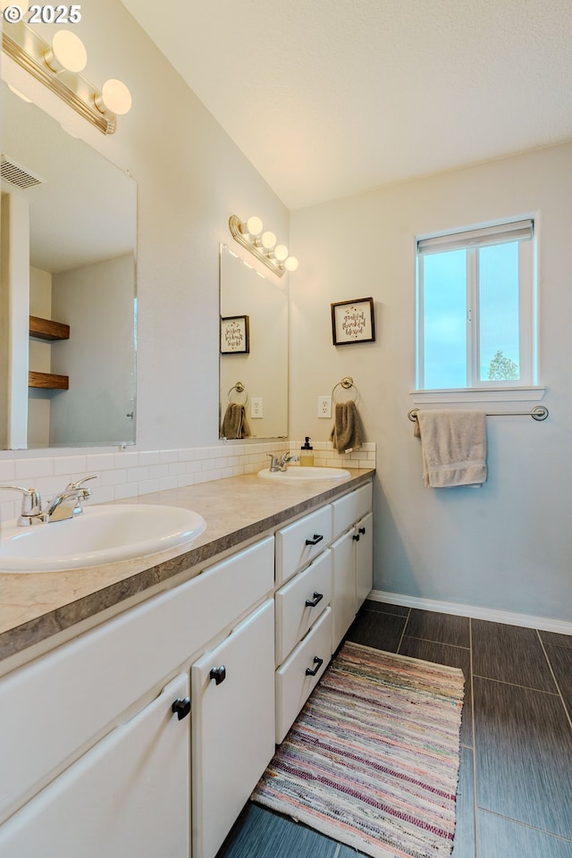 595 Cozy Way, Woodburn, OR 97071 - full bathroom featuring double vanity and baseboards