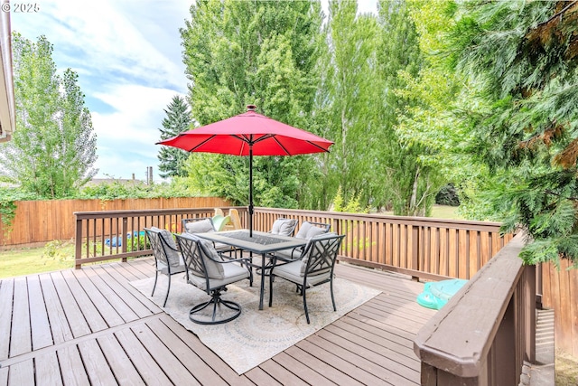 595 Cozy Way, Woodburn, OR 97071 - wooden deck featuring outdoor dining space and a fenced backyard