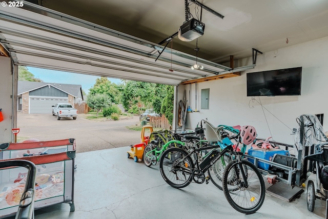 595 Cozy Way, Woodburn, OR 97071 - garage with a garage door opener and electric panel